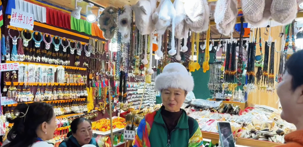 A lady wearing Tibetan hat - Jiuzhaigou Travel Guide: Magical Valley - Leo Trails