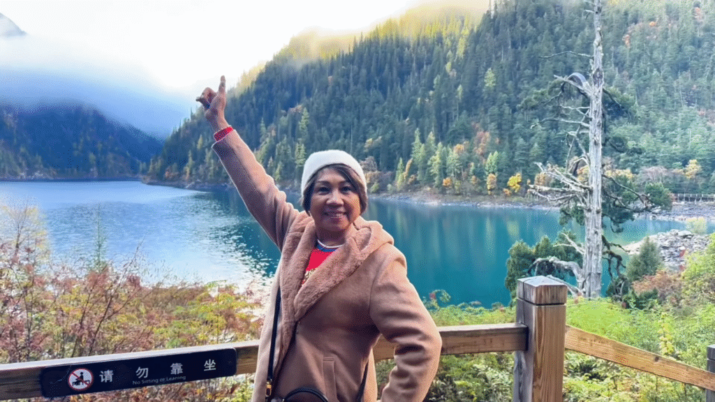 Mom posing at the lake - Jiuzhaigou Travel Guide: Magical Valley - Leo Trails