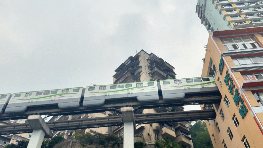 Train runs through a building in Lǐzǐbà Station (李子坝) - Ultimate Chongqing Itinerary: 7 Top Attractions - Leo Trails