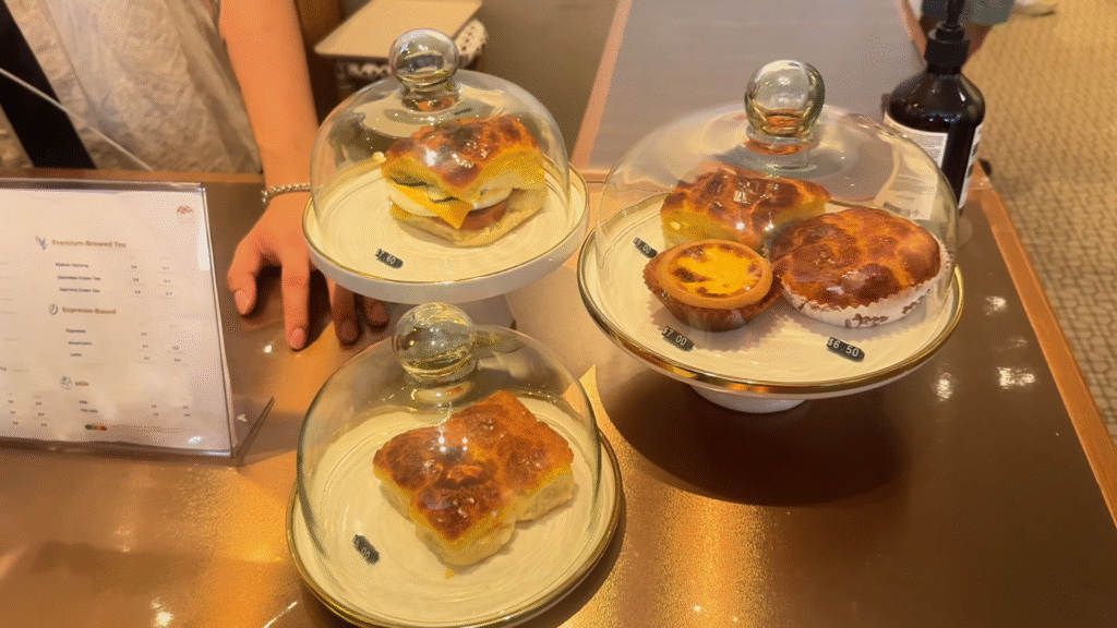 Bolobuns in glass cake container - How to Enjoy Singapore Without Breaking the Bank- Leo Trails
