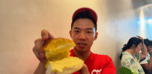 Me eating classic bun with butter - How to Enjoy Singapore Without Breaking the Bank - Leo Trails