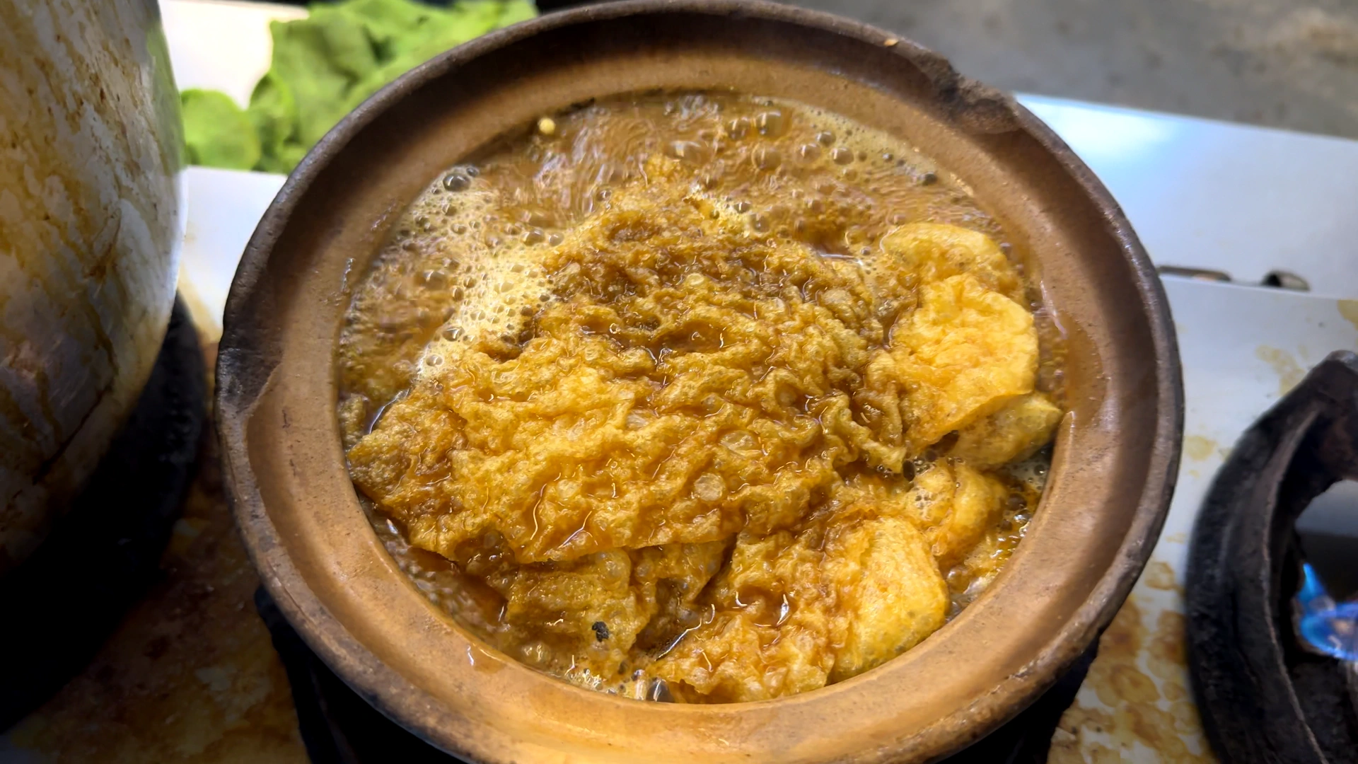 A closeup photo of boiling bak kut teh -Try KL Dishes That Locals Love - leo trails