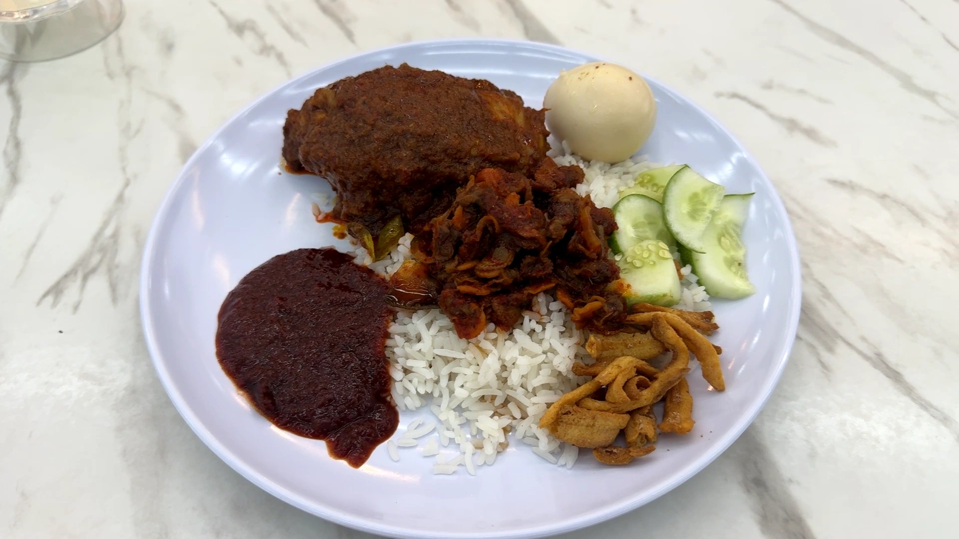 A plate of nasi lemak -Try KL Dishes That Locals Love - leo trails