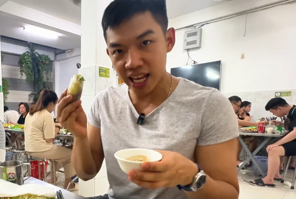 Leo Eating Banh Xeo - 9 Best Vietnamese Snacks That’ll Make You Crave- Leo Trails