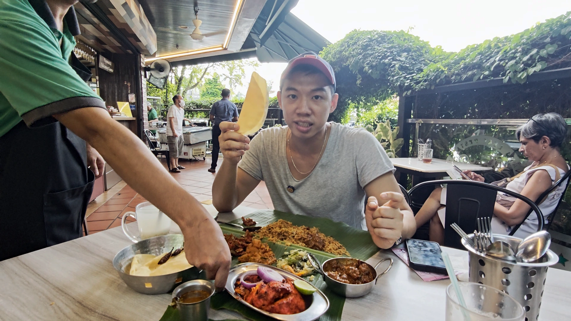 Me holding a papadum -Try KL Dishes That Locals Love - leo trails
