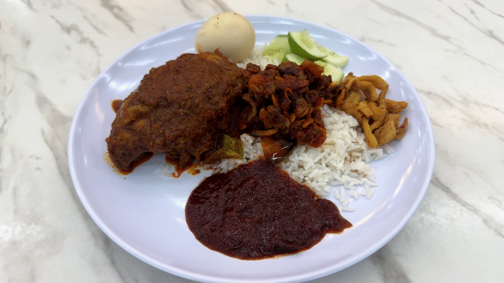 a plate of Nasi Lemak - 15 Must-Try KL Dishes That Locals Love - leo trails