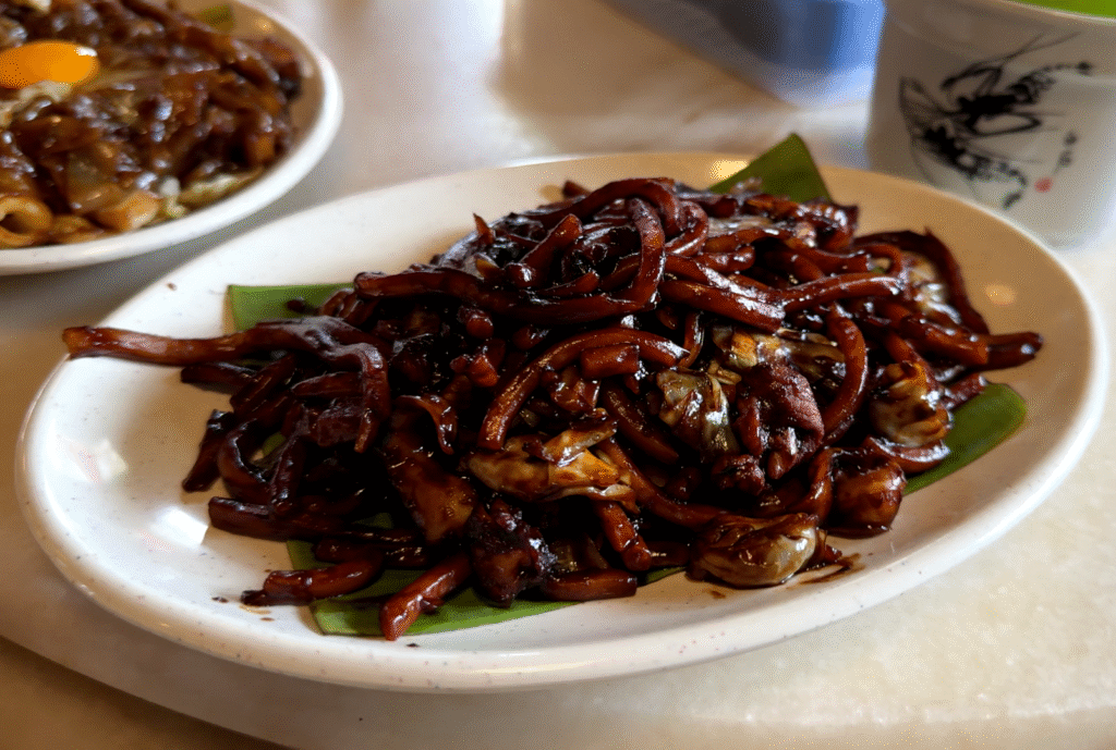 A plate of Hokkien Mee - 15 Must-Try KL Dishes That Locals Love - leo trails