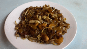 A plate of Char Kway Teow - 15 Must-Try KL Dishes That Locals Love - leo trails