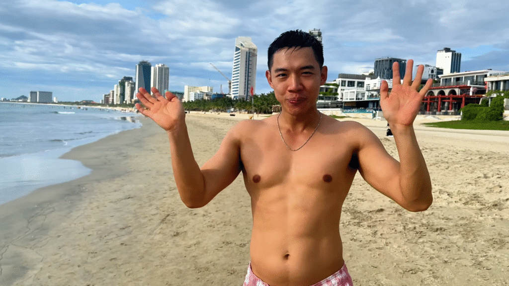 Me waving at My Khe Beach - The Ultimate Travel Guide to Da Nang - Leo Trails