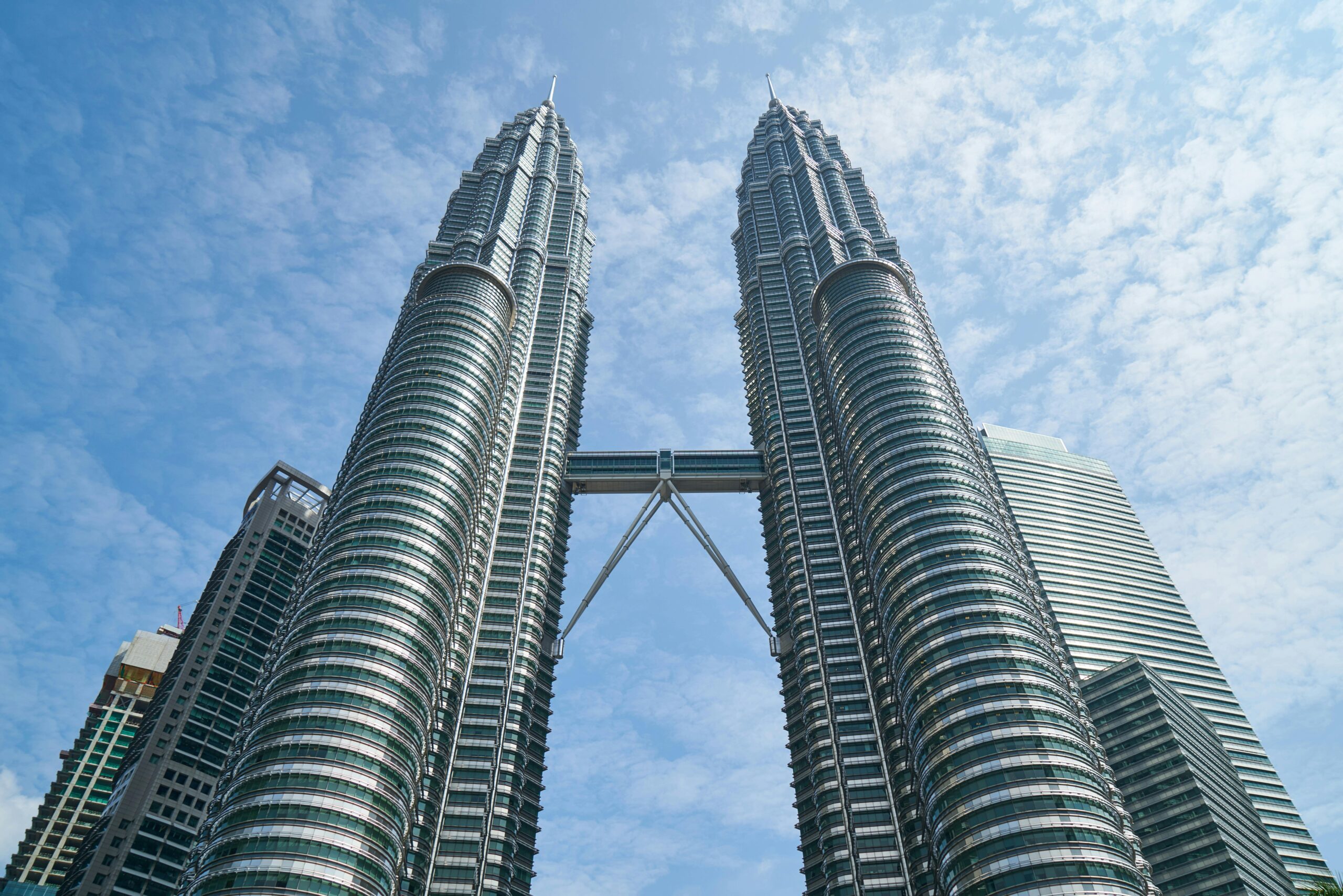 pexels-photo-433942-433942 The iconic Petronas Twin Towers against a bright blue sky in Kuala Lumpur, Malaysia.