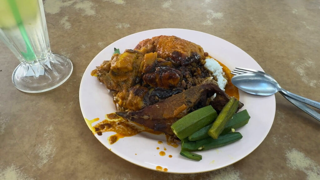 a plate of Nasi Kandar - 15 Must-Try KL Dishes That Locals Love - leo trails