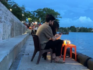 Couple enjoying eating Tofu Pudding - 7 Fun Things to Do in Hue, Vietnam - Leo Trails