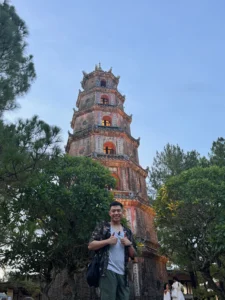 Me Posing at Thien Mu Pagoda - 7 Fun Things to Do in Hue, Vietnam - Leo Trails