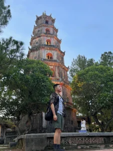 Me Standing at Thien Mu Pagoda - 7 Fun Things to Do in Hue, Vietnam - Leo Trails