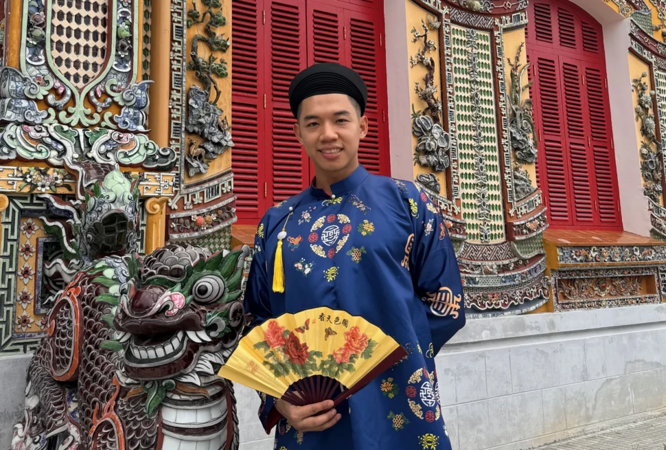 Me posing with the statue at Hue Imperial City - 7 Fun Things to Do in Hue, Vietnam - Leo Trails