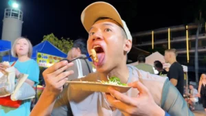 Me eating Fried Squid Egg - Chiang Mai Sunday Night Market: What to do here - Leotrails
