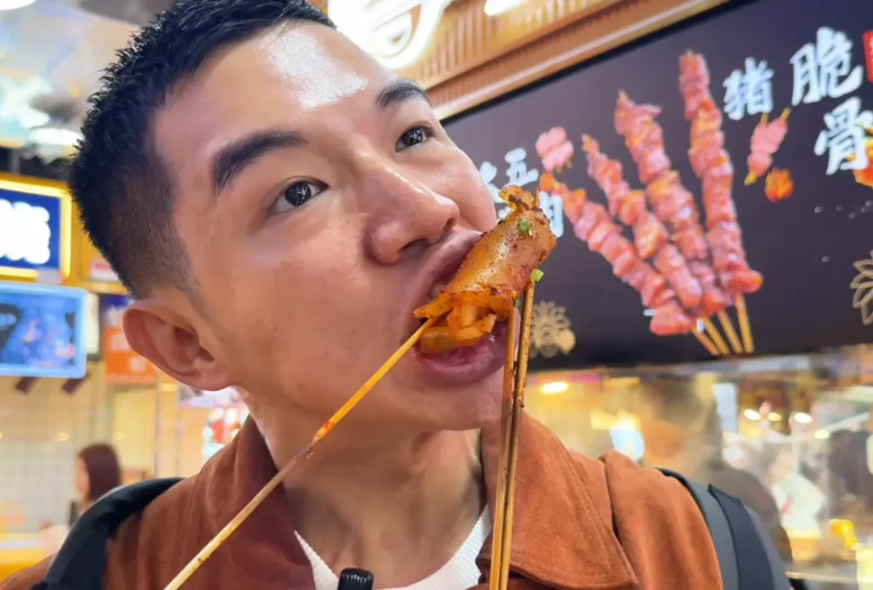 Me eating Shao Pi - A Local Favorite Street Food Paradise in Chongqing - Leotrails