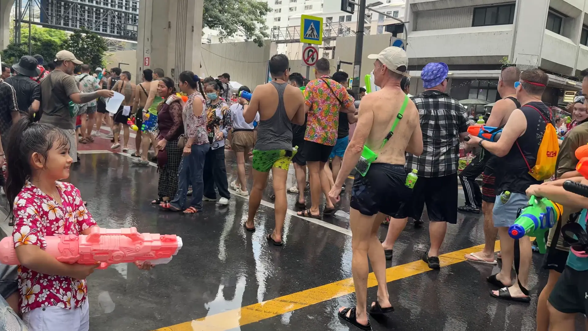 Crowds of People in the Silom Road - The Wildest Songkran Water Fight in Silom Bangkok 💦 - Leotrails