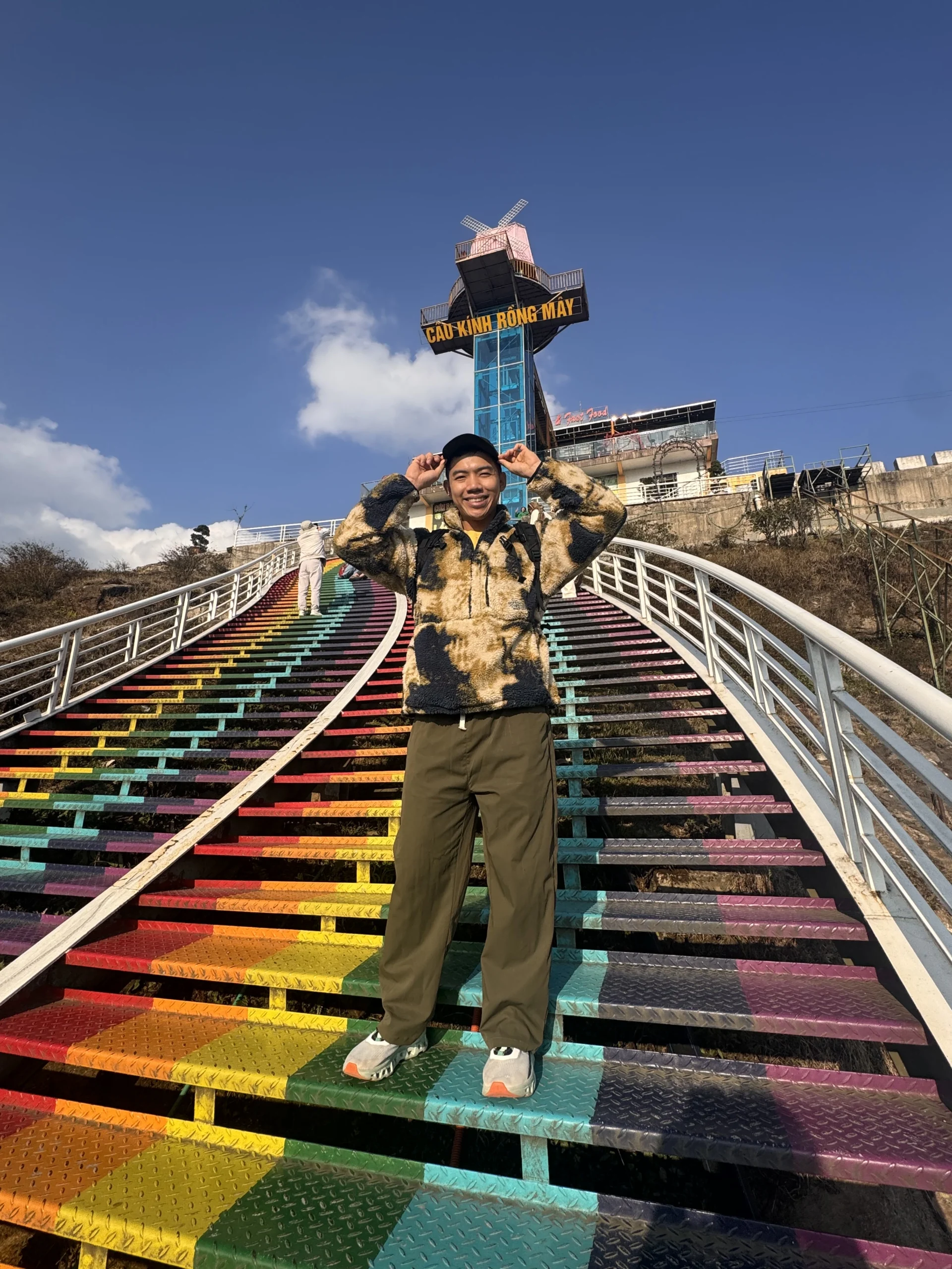 Me standing on the Rainbow Stairs at Glass Bridge - How Much Does Sapa Travel Cost? My Day 1 Breakdown 💸- Leotrails
