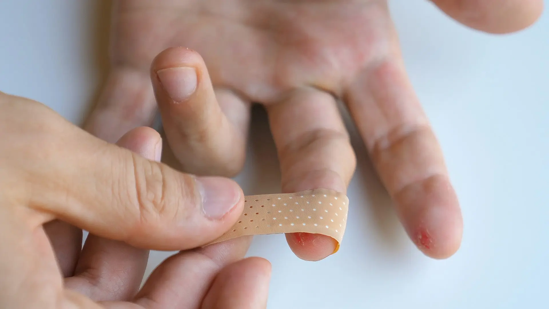A Bandage wrap around the middle finger A Bandage wrap around the middle finger - Liquiplast for Cracked Skin: Must Have Travel Item 🩹 - Leotrails
