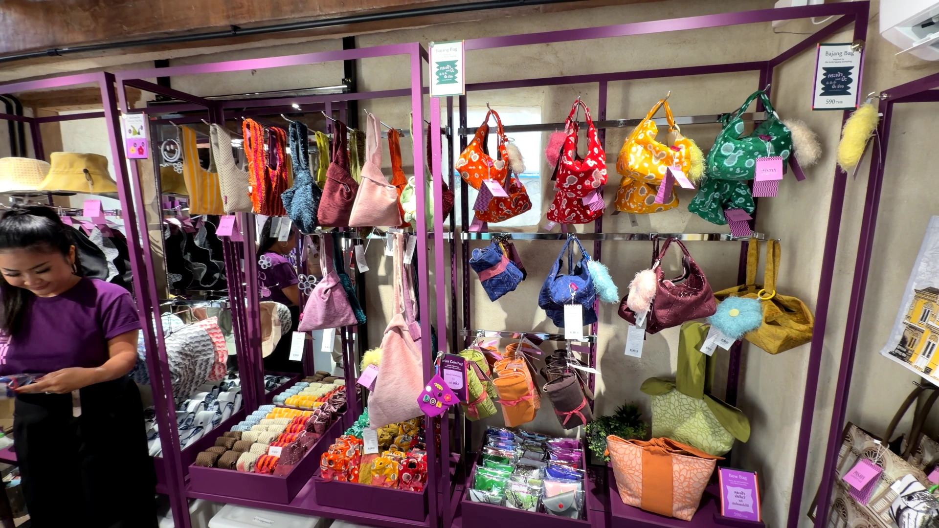 Colorful bags are hanging on the wall - Song Wat Bangkok: How to Spend a Day Here 🏠 - Leotrails