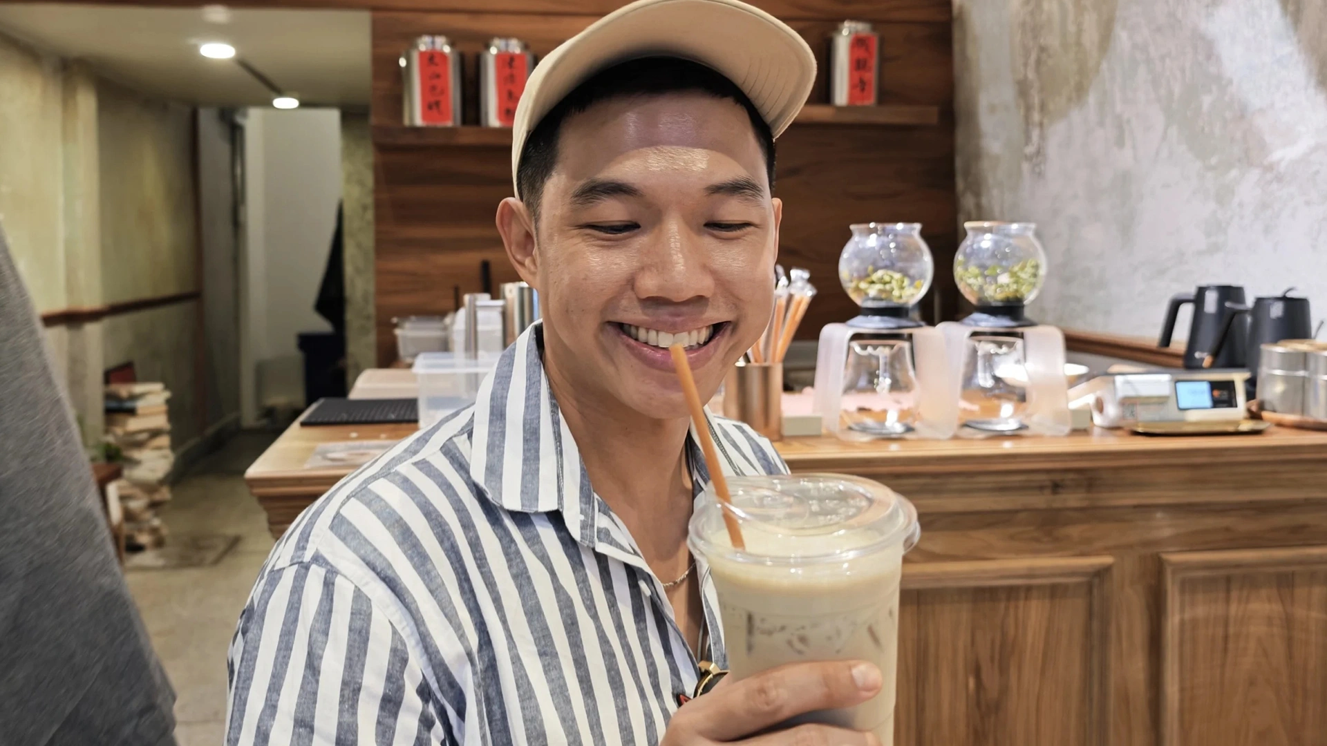 Me holding a milk tea - Song Wat Bangkok: How to Spend a Day Here 🏠 - Leotrails