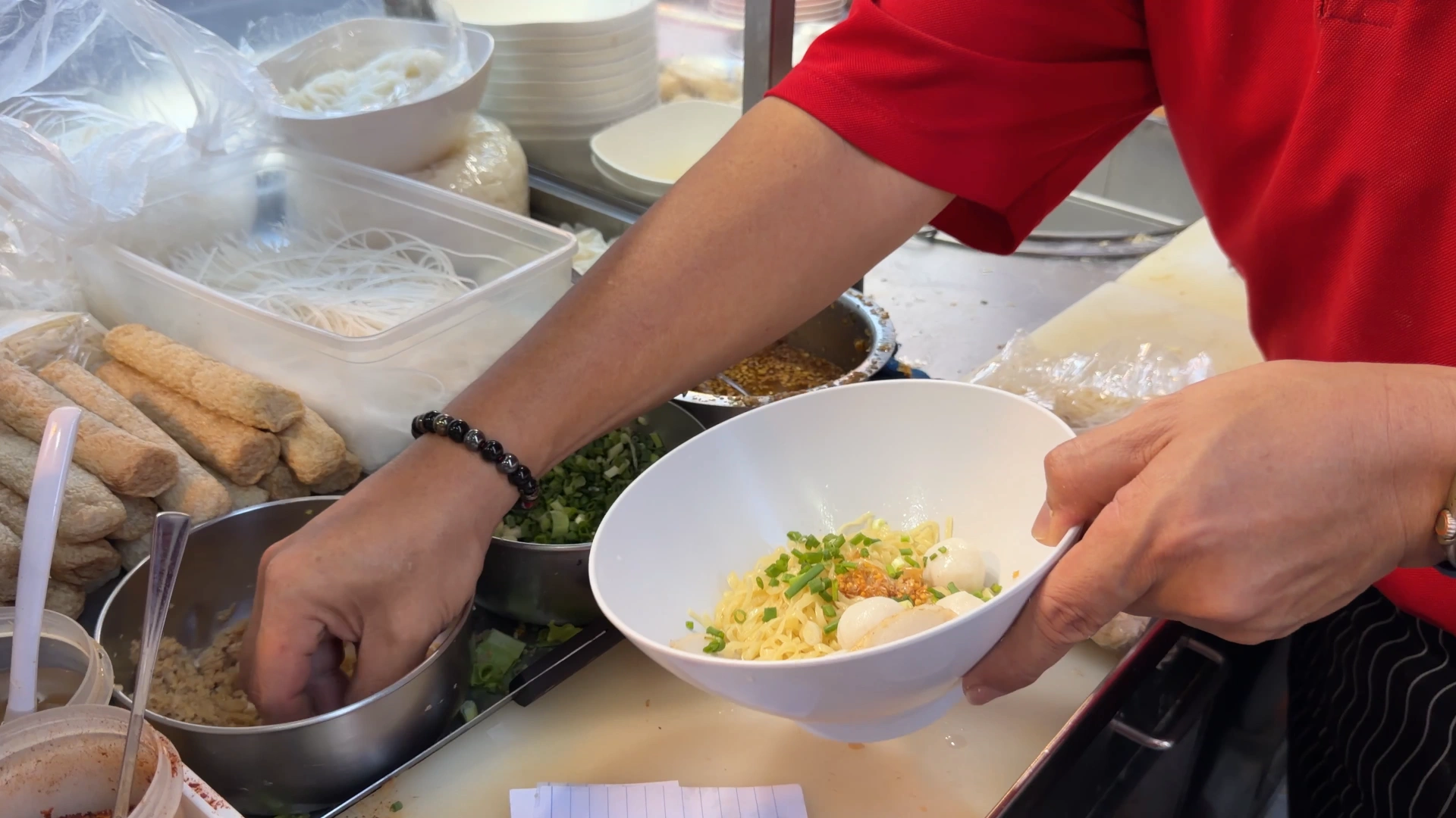The owner serving up the noodles - Song Wat Bangkok: How to Spend a Day Here 🏠 - Leotrails