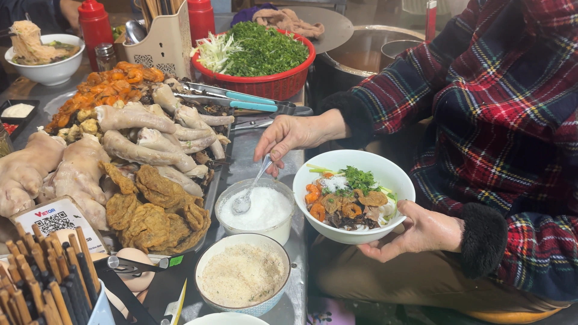 an old woman is preparing a Bún tôm - What to Eat in Haiphong: Amazing Local Food Experience😋 - Leotrails