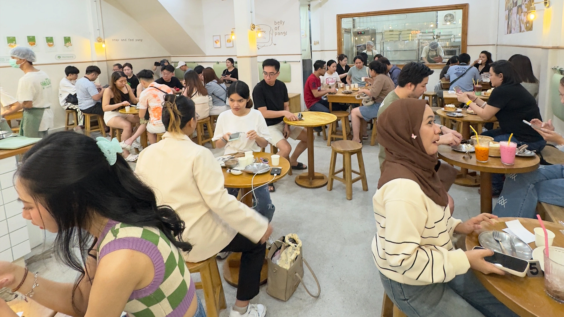 Customers dining inside June Pang dessert shop on Banthat Thong Road in Bangkok