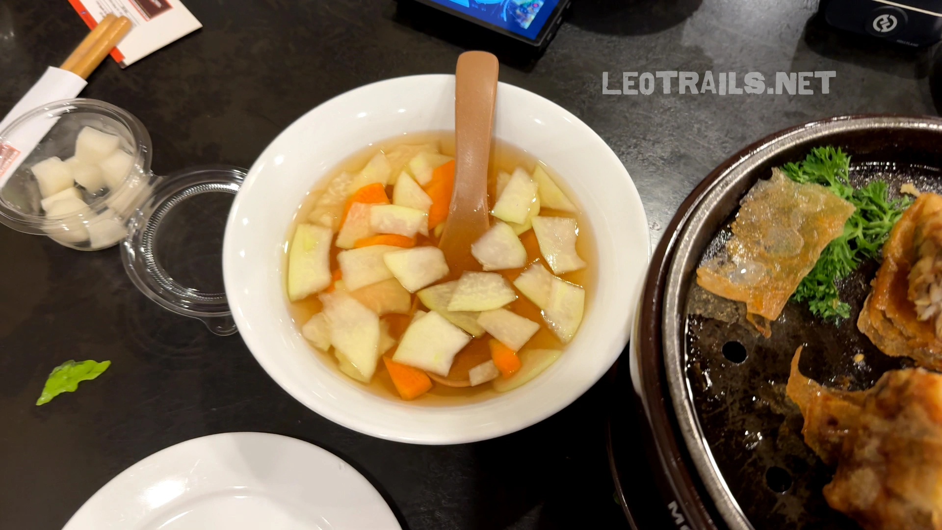 Traditional Vietnamese sweet and sour dipping sauce with pickled vegetables for spring rolls.